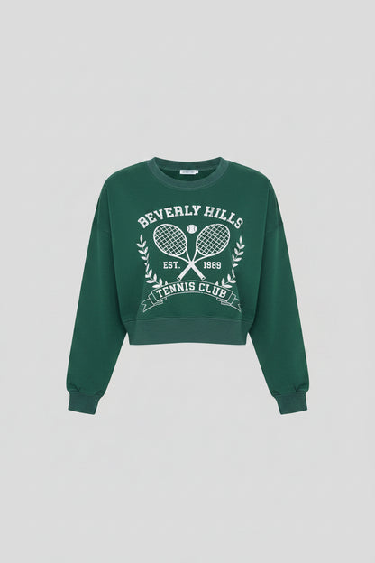 Luxury Clique forest green cropped sweatshirt with white Beverly Hills Tennis Club graphic and ribbed crew neck.