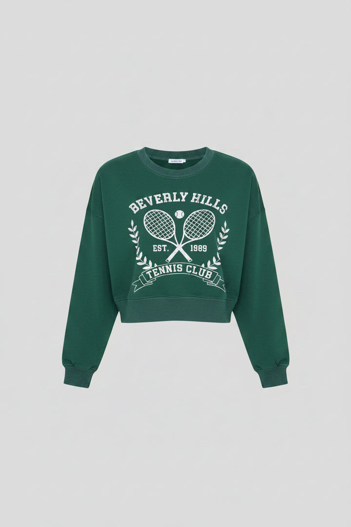 Luxury Clique forest green cropped sweatshirt with white Beverly Hills Tennis Club graphic and ribbed crew neck.